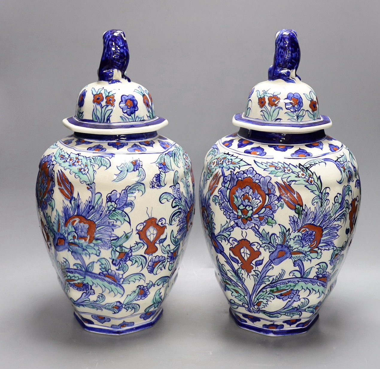 A pair of Belgian keramis jars and covers, 41cm